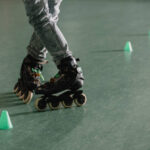 Cropped view of children legs in roller skates in special position