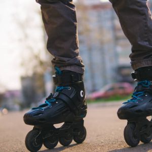 Close-up of roller skates on feet . Man on roller skates